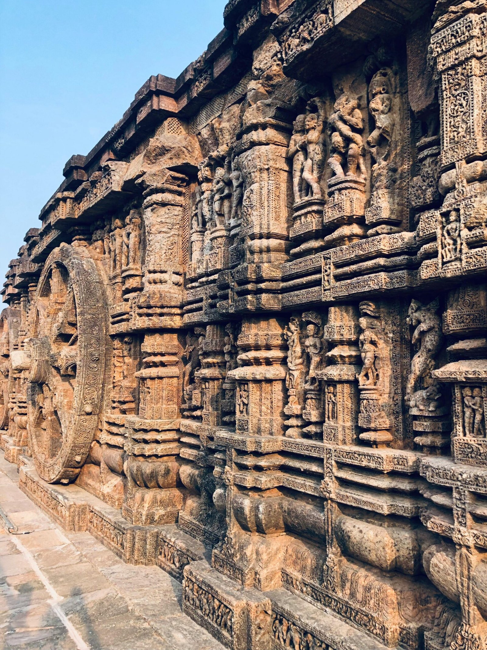Detailed carvings on the walls of the Konark Sun Temple showcasing Kalinga architecture.